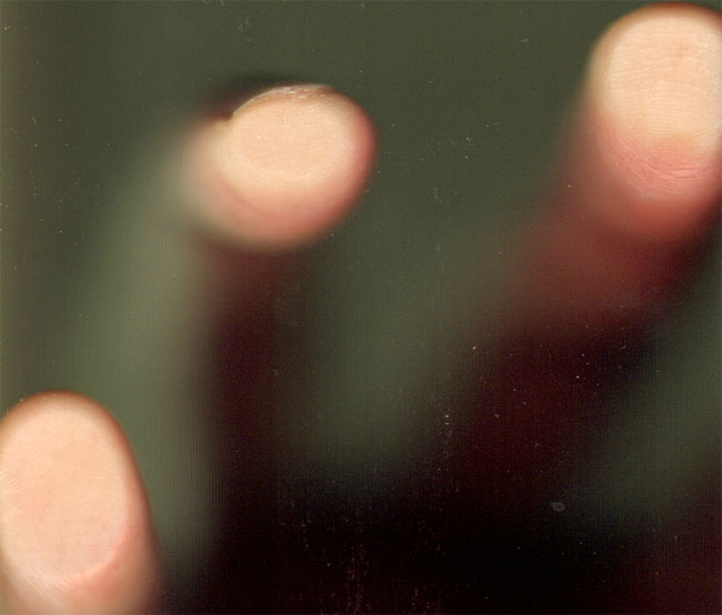 drie vingers en een vieze glasplaat