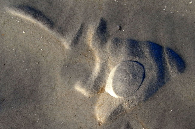 stempel in het zand?